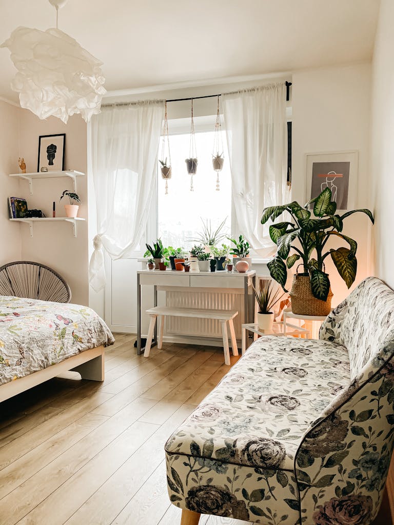 A bright and airy Scandinavian-style bedroom featuring indoor plants and floral decor.