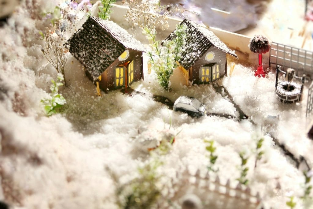 Miniature Christmas houses covered with snow