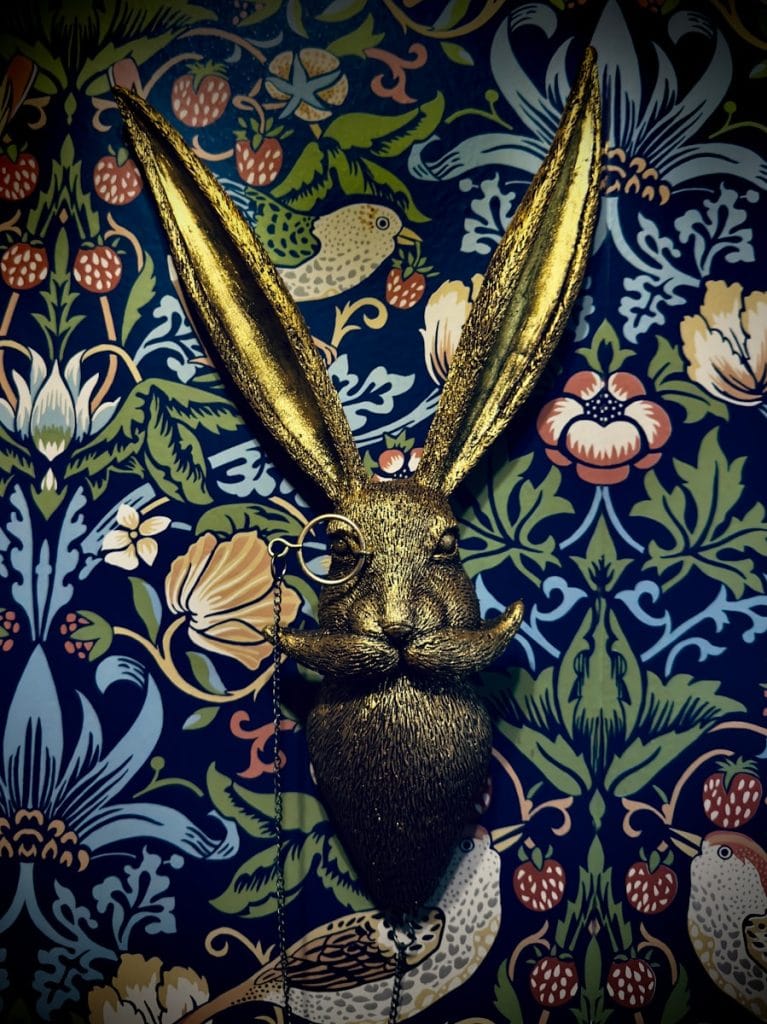 Golden rabbit head with monocle and mustache